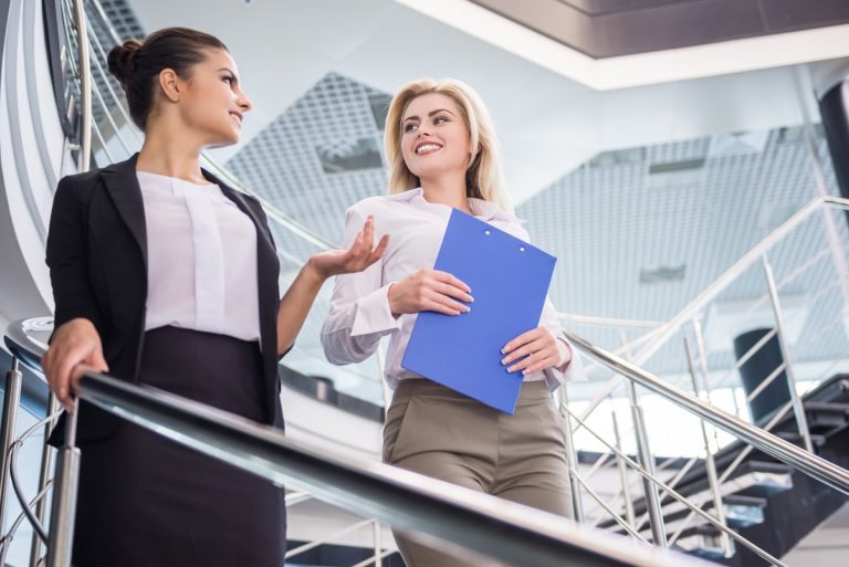 Employees incorporating movement in workplace using stairs